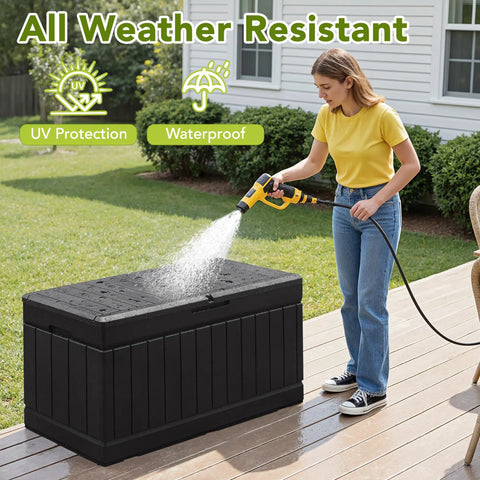 78 Gallon Waterproof Resin Deck Box With Lockable Bench being cleaned with a hose on a patio, showcasing all-weather durability.