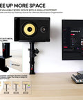 Clamp On Desk Speaker Stands For Dual Monitors, Height Adjustable Tilt, Desktop Mounts with metal clamp securing a speaker.