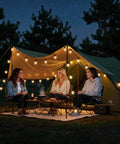Three women sitting under a tent decorated with 50ft G40 Outdoor String Lights With 26 LED Bulbs, Waterproof Shatterproof Dimmable Connectable Globe Cafe Bistro Lights For Patio And Backyard, Balcony, Gazebo, Party, Black.