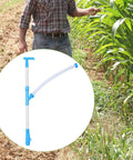 Manual Fertilizer Spreader Tool For Farm Use And Home Garden, 90cm Ergonomic PVC Handle, Easy Control, shown next to corn field