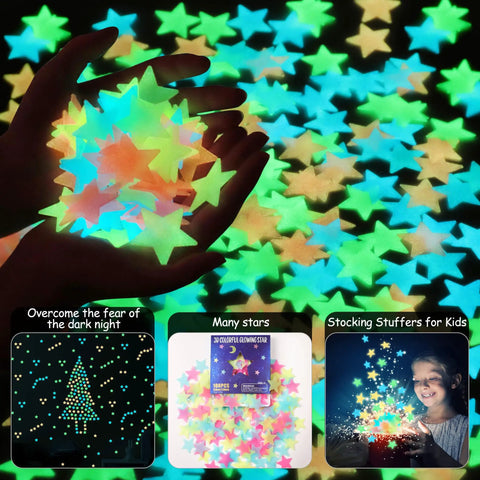Hands holding Glow In The Dark Luminous Star Wall Decals Set 100 Multicolor Pieces For Kids Room Nursery And Ceiling Decor Easy Peel And Stick Lit Night Sky Glow In The Dark Wall Stickers For Bedroom.