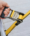 Heavy Duty Ratchet Tie Down Straps 1.5 Inch By 16 Foot 5000 Lb Load Rating 2 Pack with padded handle in use.
