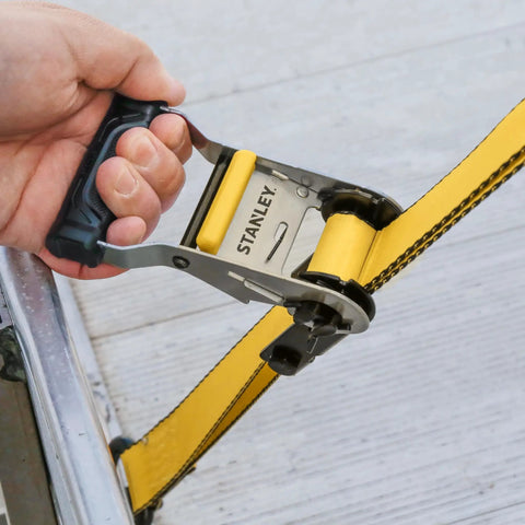 Heavy Duty Ratchet Tie Down Straps 1.5 Inch By 16 Foot 5000 Lb Load Rating 2 Pack with padded handle in use.