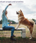 Woman using Five Pack Cut Resistant Arm Sleeves For Men And Women, Level Five Bite Proof Forearm Guards, playing with dog outdoors.
