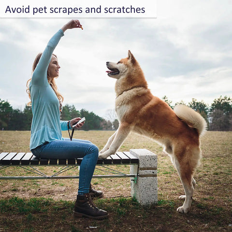 Woman using Five Pack Cut Resistant Arm Sleeves For Men And Women, Level Five Bite Proof Forearm Guards, playing with dog outdoors.