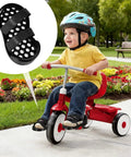 Child on tricycle showing Adaptive Pedal Stabilizers for bikes with adjustable foot support straps, mobility aid