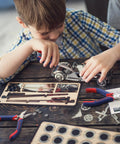 Child using Mini Pliers Set 3-Piece Handy Tool Kit With 4 Inch Diagonal Pliers, 5 Inch Long Nose Pliers, and 6 Inch Needle Nose Pliers for crafting model car.
