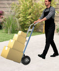 Built Tough Heavy Duty Aluminum Hand Truck With Smooth Rolling Rubber Wheels 500 Pound Max Capacity Furniture Moving Helper Dolly being used outdoors.