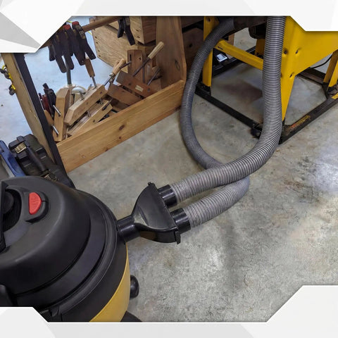 2.5 Inch ABS Vacuum Y Connector Splitter With Independent Blast Gates For Dual Hoses installed in a workshop setting