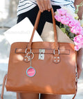 Leather handbag with attached round badge from Metal Button Making Kit With 50 Sets Of Round Badge Parts 32mm 1.26 Inch Mirror Backing