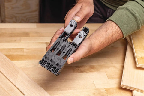 Person holding Pocket Hole Jig Micro For Thin Stock And Cabinets for thirty three percent smaller micro pocket holes in one half and three quarter thick materials.