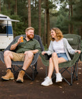 Two Pack Oversized Heavy Duty Camping Chairs Padded And Foldable With Cup Holder And Cooler Bag Portable Lawn Chairs For Sports And Outdoors Supports Up To 450 Lbs Grey in use during camping