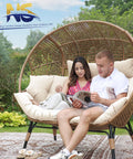 Couple sitting on Oversized Double Egg Chair For Indoor And Outdoor Use With Thick Padded Cushions Two Seater Loveseat in garden