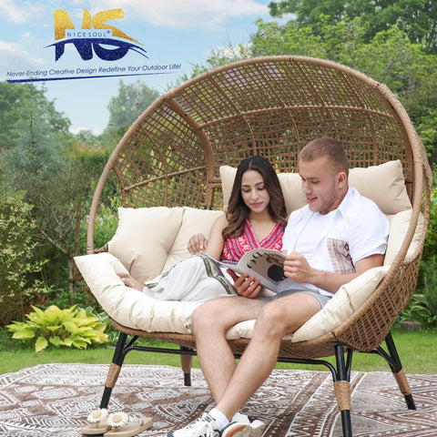 Couple sitting on Oversized Double Egg Chair For Indoor And Outdoor Use With Thick Padded Cushions Two Seater Loveseat in garden