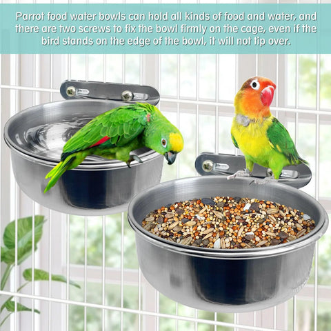 Front view: two stainless steel bird bowls with clamp-on cage mounts; one bowl filled with seed mix.