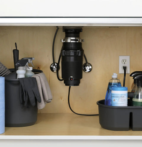 One Third Horsepower Continuous Feed Garbage Disposal With Easy Install Kit And Power Cord Included For Two Person Homes shown installed under sink.