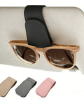 Keep Your Dash Clean With This Beefy Magnetic Leather Sunglass Holder Snapping Tight On Visors Grabbing Shades Cards And Cash Secure So Your Ride Stays Fresh Forever. Black leather holder with sunglasses on car visor.