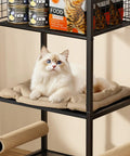 Cat resting on cushioned bed of Four In One Cat Furniture Stand With Scratching Post Dual Feeding Bowls Cozy Bed Platform And Built In Storage Organizer For Small Spaces Matte Black Cat Tower That Dope Setup Adds Serious Space Savings And Cat Happiness.