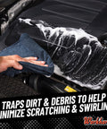 Hand using Workhorse Pro Microfiber Towels For Cars, 16x16 Inch, Ultra Soft Scratch Free Detailing Cloths on car engine, wiping foam.