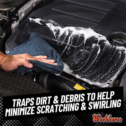 Hand using Workhorse Pro Microfiber Towels For Cars, 16x16 Inch, Ultra Soft Scratch Free Detailing Cloths on car engine, wiping foam.