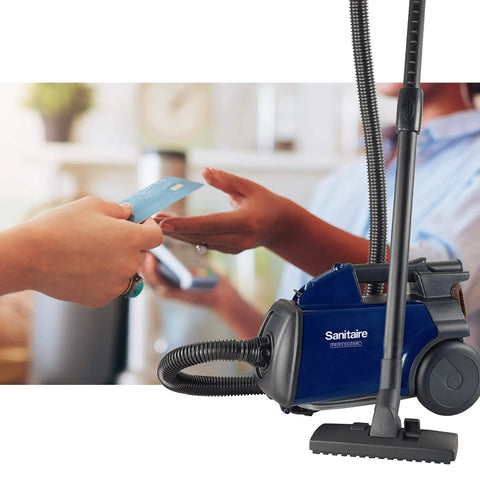 Lightweight Canister Vacuum Cleaner For Smooth Carpet Sweep With 800 Watt Engine And Four Flexible Hose Tools Knockout Suction Takes Heavy Filth Off Your Floor Budget Friendly No Sweat Daily Grind in use at a retail shop.