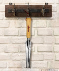 Five In One Hand Weeder Puller Tool For Garden Weeds Dandelion Fork And Weeding Knife With Deep Digging hanging on wall