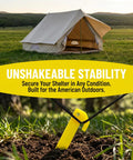 9 inch yellow plastic tent peg inserted in ground, anchoring a tent on a grassy field; 24 Pack 9 Inch Yellow Plastic Tent Pegs Stakes For Camping And Outdoor Use Durable Lightweight PP Stakes For Tents Awnings Beach Lawn Garden Easy Insertion Weather Resistant Ground Fixation.