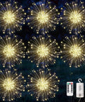 Display of Lit 8 Pack LED Copper Wire Firework String Lights With Remote, Dimmable And Waterproof IP65, shown hanging outdoors at night