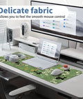 XL Plant Themed Mouse Pad 31.5 X 11.8 Inches on desk with laptop, headphones, and mouse, showing green plant design and non-slip base.