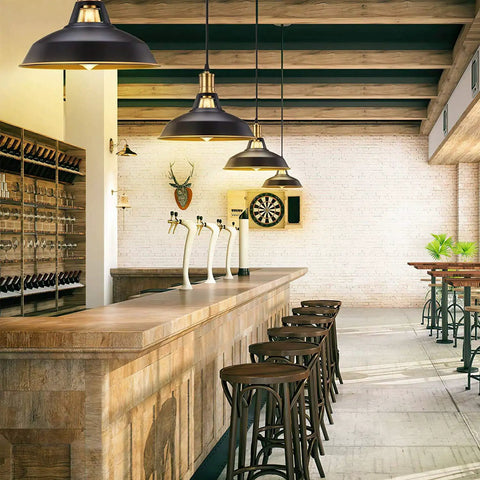 Industrial Farmhouse Pendant Light Three Pack With Oil Rubbed Black Finish above wooden bar in modern kitchen.