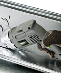 Genesis GAESB14 8 Piece Metal Shear Replacement Blade Set in use on metal sheet with GES40 Corded Electric Shear by gloved hand