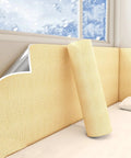 Keep Winter Warm With This 9Mm Thick Stick And Peel Wallpaper Featuring Slick Xpe Foam Self Adhesive Backing For Waterproof Soundproof Cold Wall Panels In Yellow Roll applied on a bedroom wall with a roll beside.