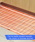 Keep Your Floors Toasty With This Electric Underfloor Heating Mat For Tile, Stone, Wood And Laminate 10 Sq Ft, 2 By 5 Feet, 120V, Easy Rollout Installation visible under flooring