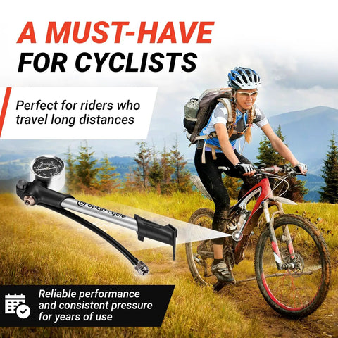 Cyclist in terrain with High Pressure Bike Shock Pump With Gauge For MTB Full Suspension 300 PSI 20 Bar Portable Manual Air Pump