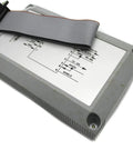 1747 Pic Series A Plc Converter Module Offering Killer Performance For Your Industrial Automation And Programming Needs Available In New Surplus Factory Sealed Or Remanufactured Like New Condition. gray PLC converter module with ribbon cable, top view