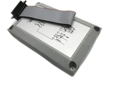 1747 Pic Series A Plc Converter Module Offering Killer Performance For Your Industrial Automation And Programming Needs Available In New Surplus Factory Sealed Or Remanufactured Like New Condition. gray PLC converter module with ribbon cable, top view