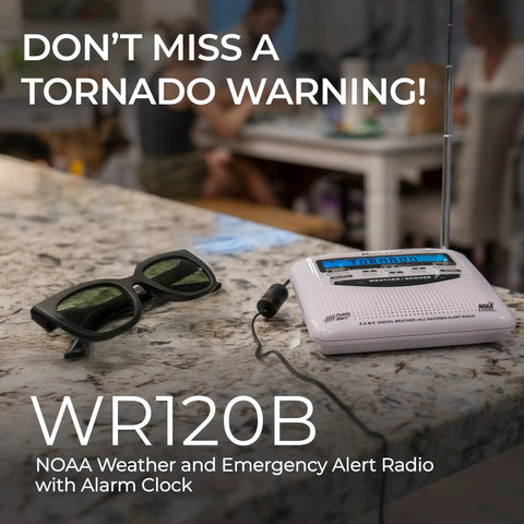 WR120B NOAA Emergency Weather Alert Radio with localized programming on kitchen counter, displaying tornado warning, sunglasses nearby.