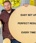 Man holding a large round wooden board with "EASY SET UP, PERFECT RESULTS, EVERY TIME" text, next to smaller round boards.
