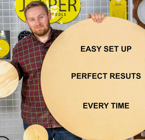 Man holding a large round wooden board with "EASY SET UP, PERFECT RESULTS, EVERY TIME" text, next to smaller round boards.