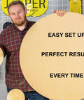 Person holding a large circle cut from wood with text 'Easy Setup, Perfect Results, Every Time' related to Heavy Duty Circle Cutter Router Jig Pro Grade Circle Jig Kit Cuts Perfect Circles From 7 To 52.75 Inches, Includes Centering Disc And Pivot Pins, Fits 50 Popular Routers Limited Edition.