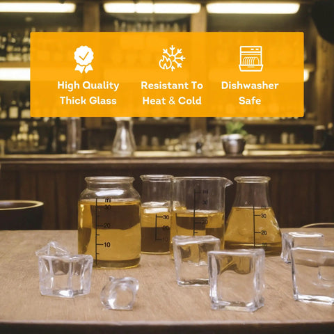 Mini Beaker And Flask Shot Glass Set With Realistic Lab Markings, Perfect Gift For Chemistry And Bio Grads, Nurses And Doctors, Clear 2 To 2 And One Eighth Inches Tall, Pack Of 4 Assorted on wooden table with drinks