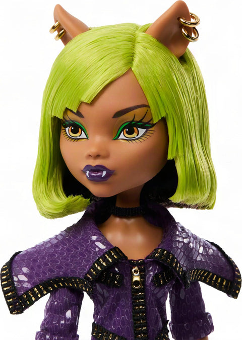Close-up of Clawdeen Wolf Dawn Of The Dance Reproduction Doll with green hair and purple zip dress.