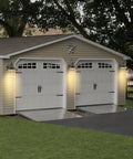 Outdoor Dusk To Dawn Sensor Wall Light Fixture Dome 12.3 Inch Black Finish illuminating garage exterior at dusk.