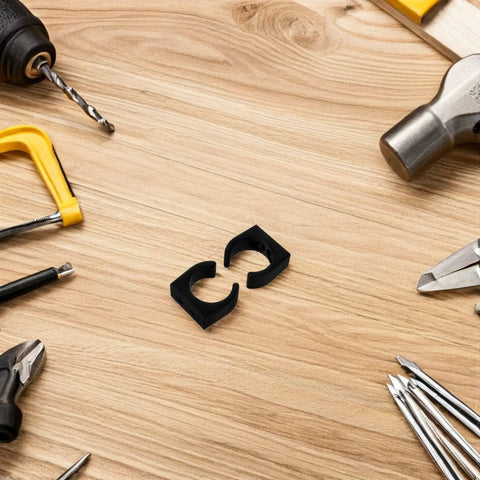 Two Pack Nylon Water Pipe Clamps For Marine Use on wooden table surrounded by tools