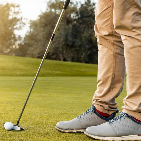 Golfer using two pack golf club shaft extension rods for wood putters with carbon fiber putter extenders on green