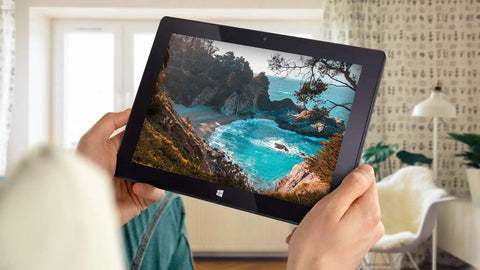 Person holding a Slick 10.1 Inch Windows 11 Tablet Pc Featuring Intel N5100 Quad Core, displaying a beach landscape.