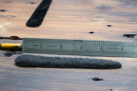 Calf Hair Recurve Bow Limb Dampeners 2 Pack For Quiet Release And Smoother Shots next to ruler for size reference