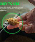 Hand holding a bait-filled spring feeder from 10 Pack Spring Fishing Feeders 25g Each For Carp Crucian And Bream Tackle