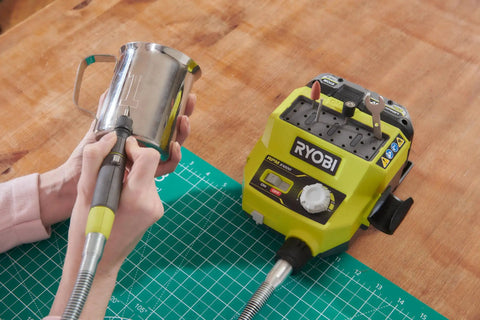 Badass 18 Volt Cordless Mini Rotary Tool With 35 Premium Accessories For Ultra Fast Diy Engraving Polishing And Precision Sanding Projects in use for engraving on a metal mug.