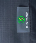 Close-up of Heavy Duty Waterproof Rectangular Patio Table Cover 86 by 44 by 27.5 Inches, showing gray ripstop fabric and logo tag.
